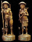 Hand-Carved Figures of Male and Female Native Hunters